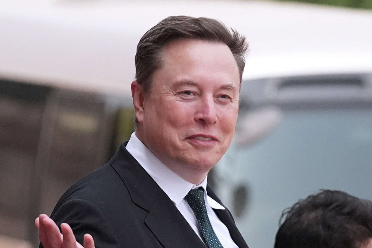 Elon Musk departs after a welcome ceremony with President Donald Trump and China's President Xi Jinping at the Great Hall of the People on May 14 in Beijing. A federal judge approved a $1.5 million settlement in an SEC case over Musk's delayed disclosure of his Twitter stake. (Mark Schiefelbein/AP Photo)