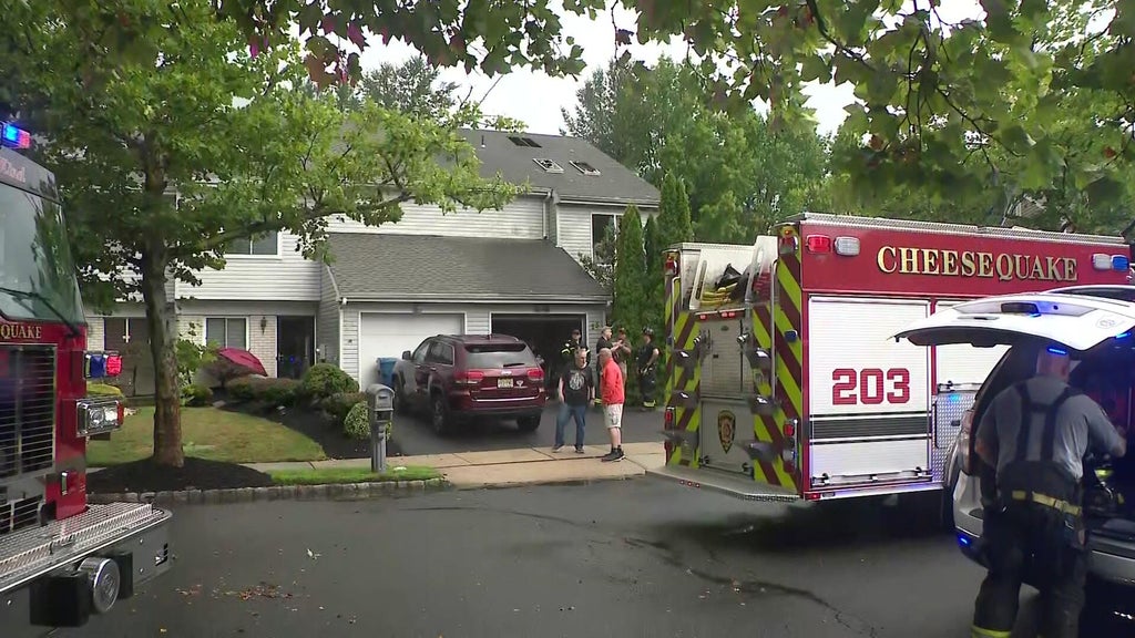 Apparent lightning strike sets Old Bridge Township, NJ., home on fire during torrential storms