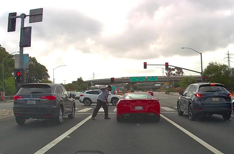 Astonishing moment red Corvette driver has vicious road-rage fight with ...