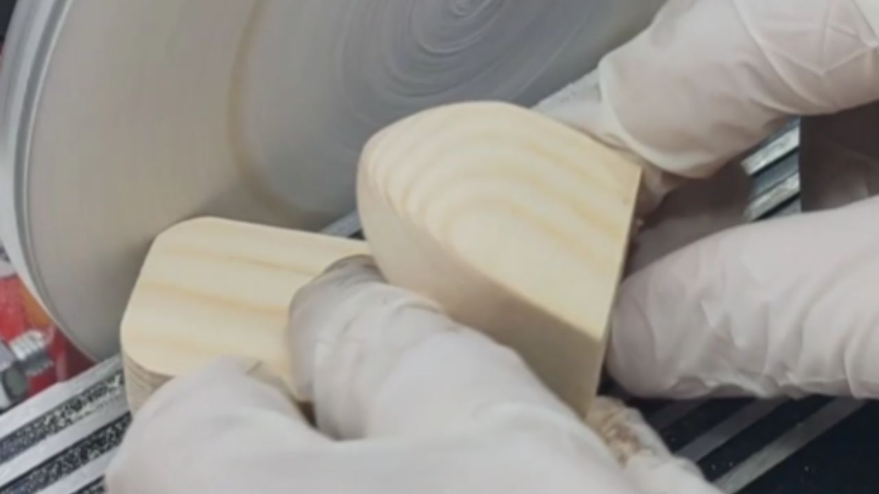 Man builds a wooden wall hanger