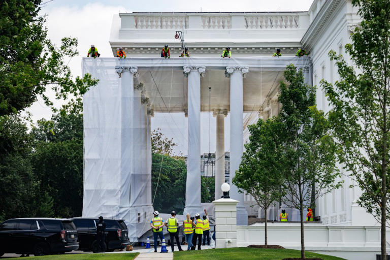 Trump posts photo of ornate columns as tarps cover White House portico