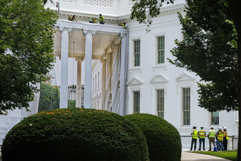Trump posts photo of ornate columns as tarps cover White House portico