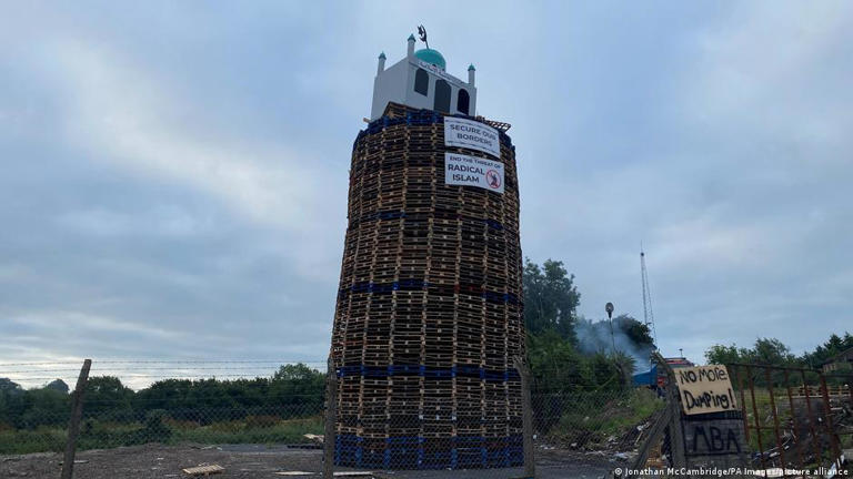 The words 'Islamic fascism' were written in Arabic on the replica mosque atop the loyalist 'Eleventh Night' bonfire pyre