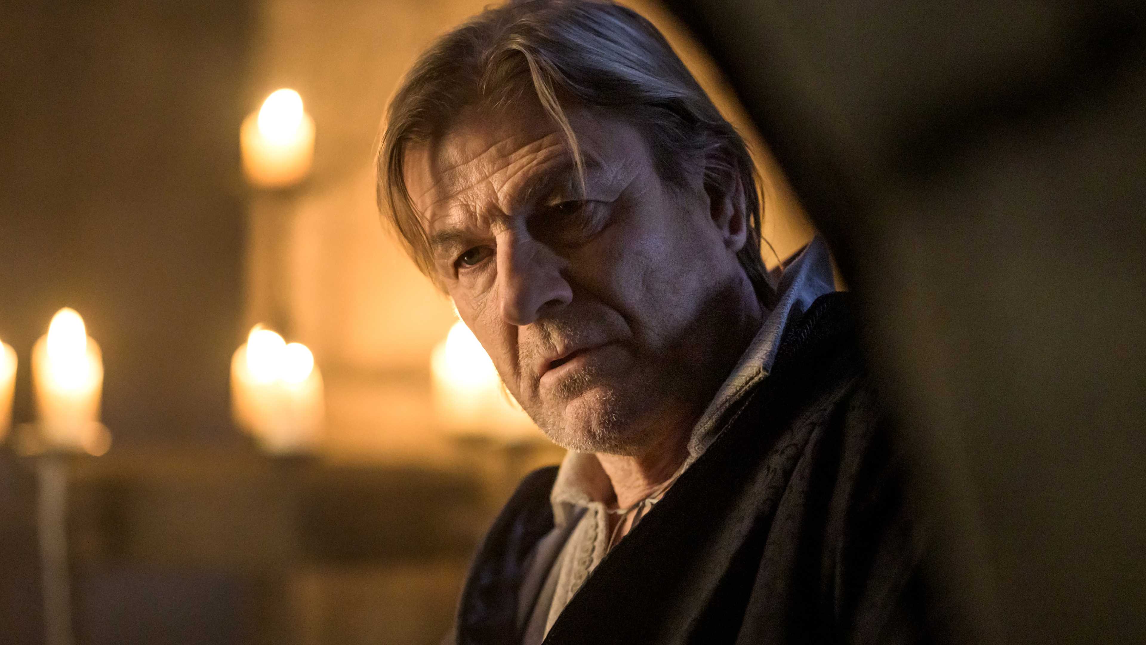 Sean Bean's Sheriff of Nottingham looking in thought around a corner in Robin Hood season 1