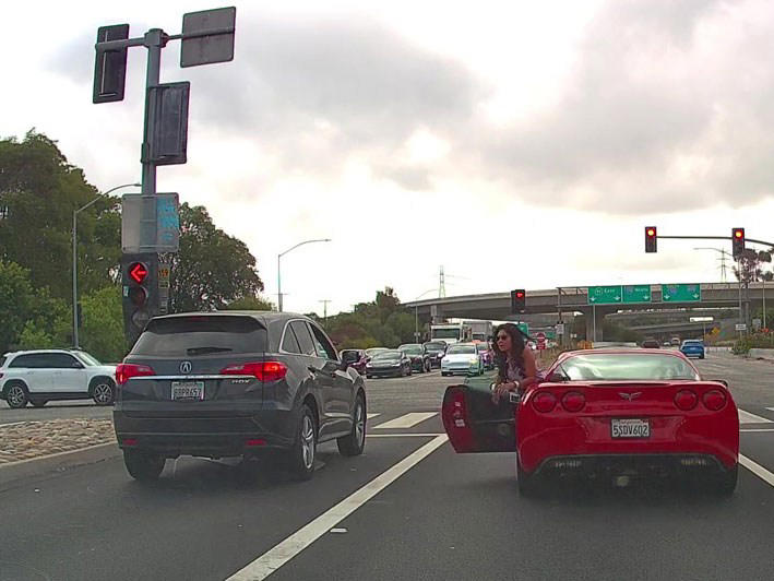 Astonishing moment red Corvette driver has vicious road-rage fight with ...