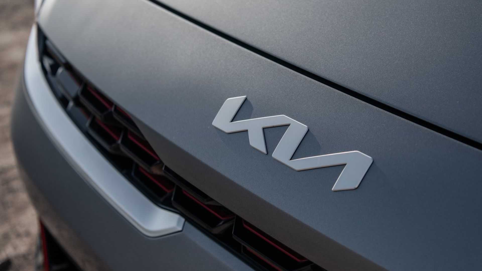 Close-up shot of the badge on the hood of a 2022 Kia Forte.