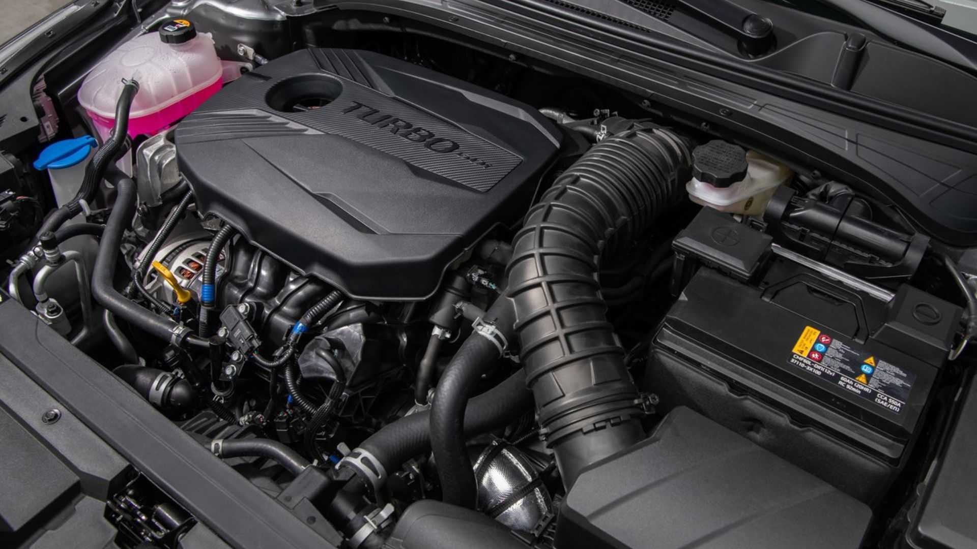 Shot of the engine under the hood of a 2022 Kia Forte.