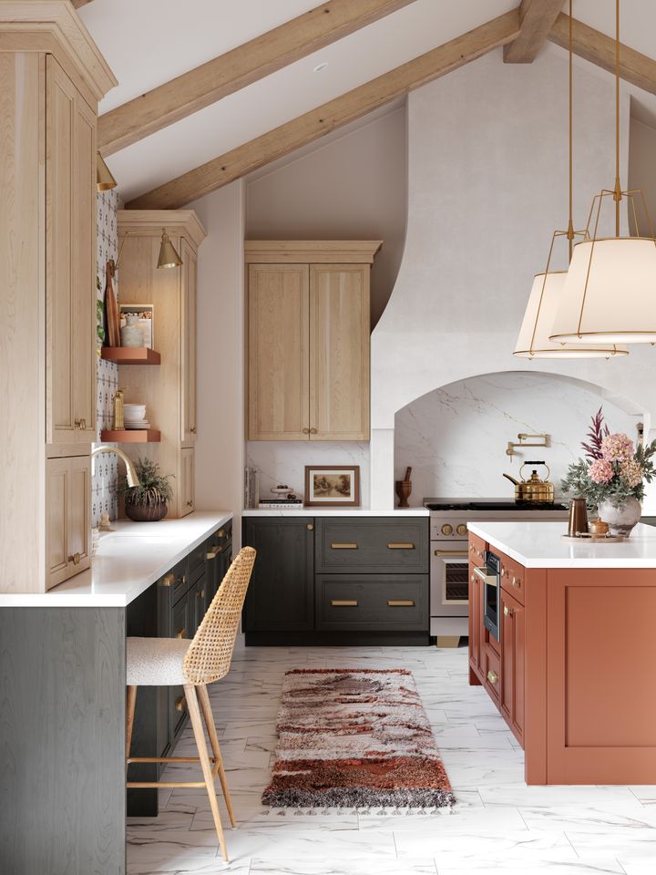Modern kitchen design with wooden cabinets a central island vaulted ceilings and decorative lighting