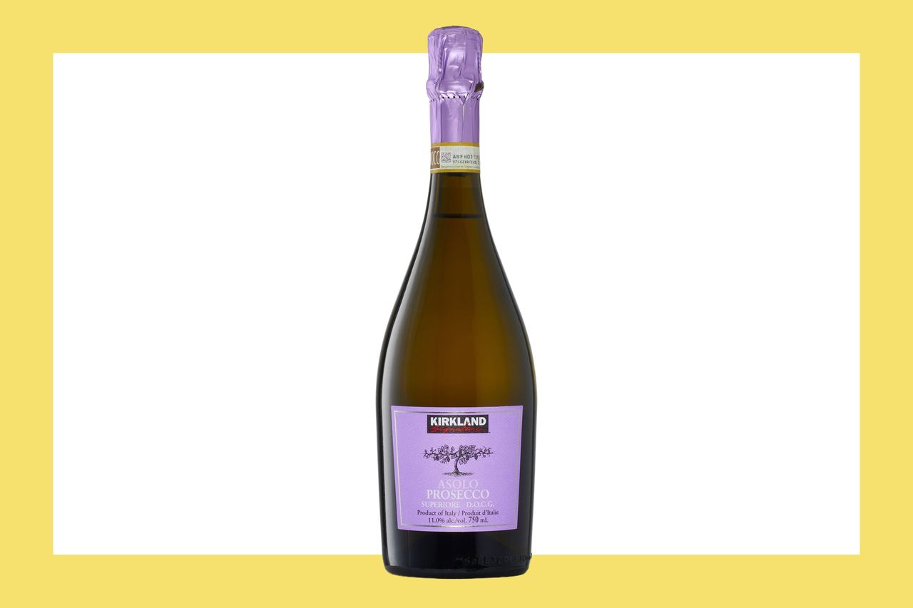 A bottle of Kirkland Signature Prosecco on a yellow background
