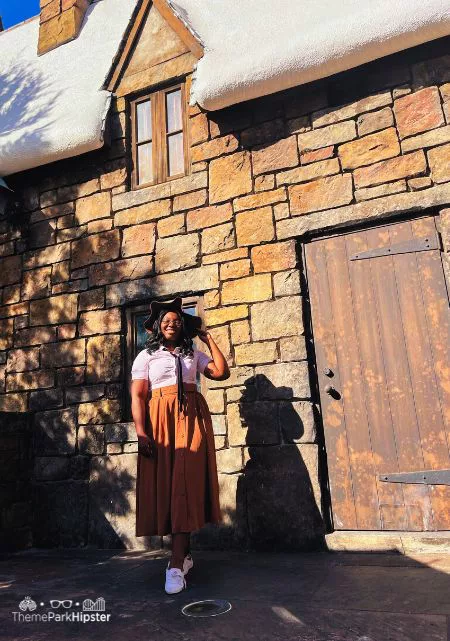 Best Spots for Wizarding World of Harry Potter Photos with Victoria Wade behind Three Broomsticks in Hogsmeade at Universal Orlando Resort.