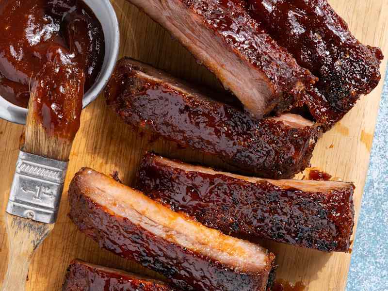 Oven baked St. Louis style ribs on butchers block.