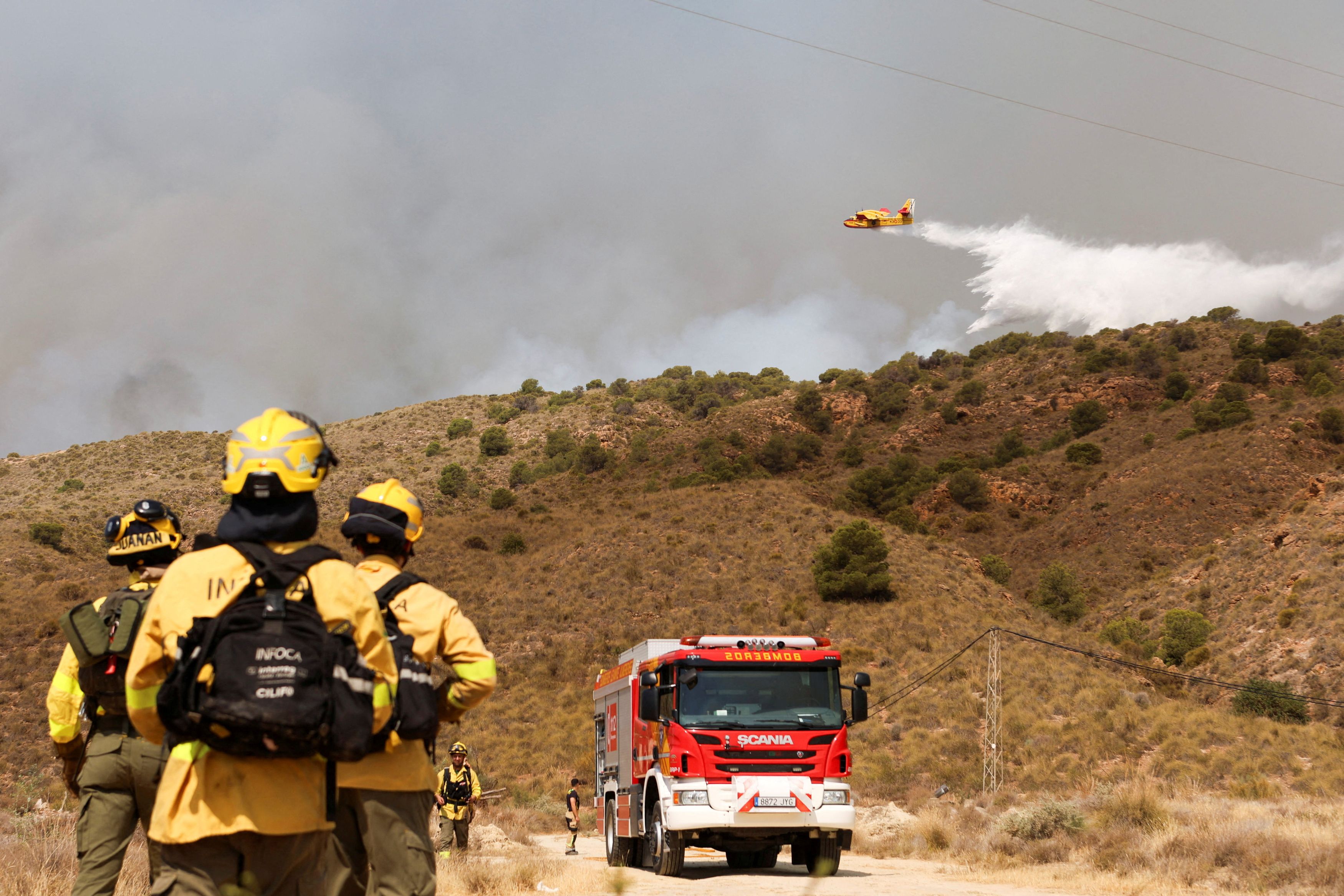 At least 11 people killed as wildfires sweep southern Spain