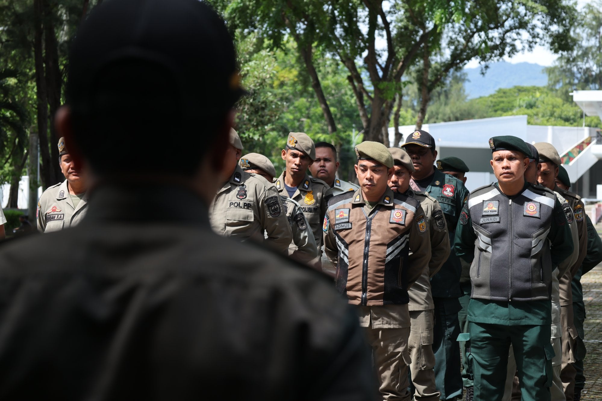 Acehnese sharia police officers at a public caning in Banda Aceh. Rights groups say authorities are expanding enforcement of sharia law online. Photo: EPA
