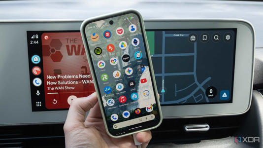 The Pixel 10 Pro in front of Android Auto running in the Ioniq 5