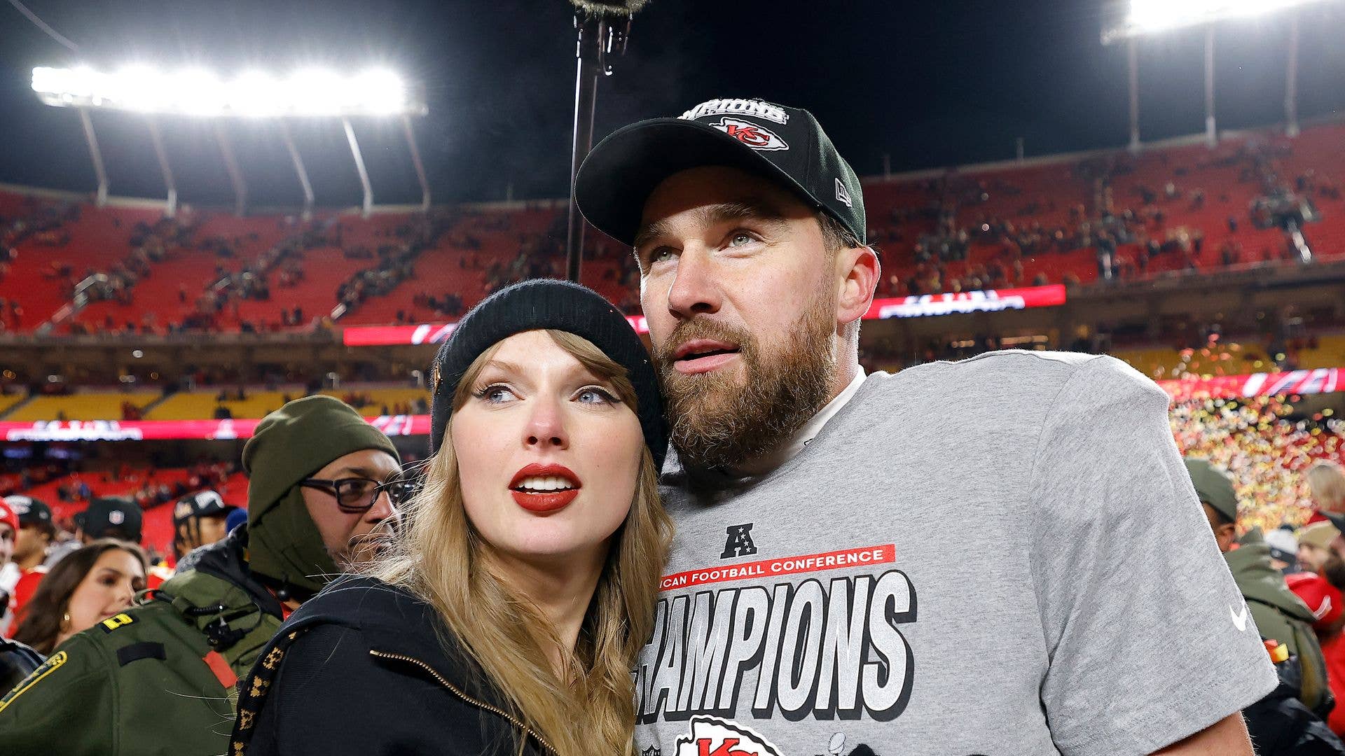 Taylor Swift celebrates with Travis Kelce #87 of the Kansas City Chiefs after defeating the Buffalo Bills 32-29 in the AFC Championship Game at GEHA Field at Arrowhead Stadium on January 26, 2025 in Kansas City, Missouri. (Photo by David Eulitt/Getty Images)