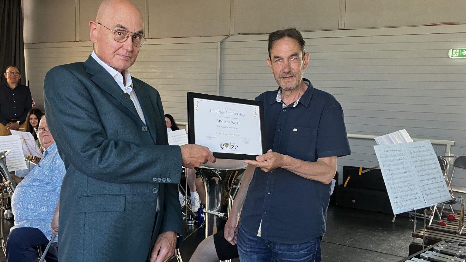 Andrew Keirl, left, has been made an Honorary Member of the Cornwall Youth Brass Band for his donation