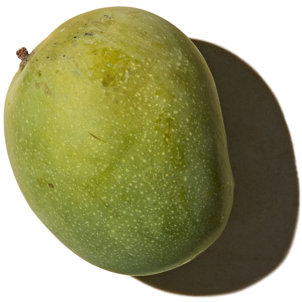 A ripe mango shown against a plain background