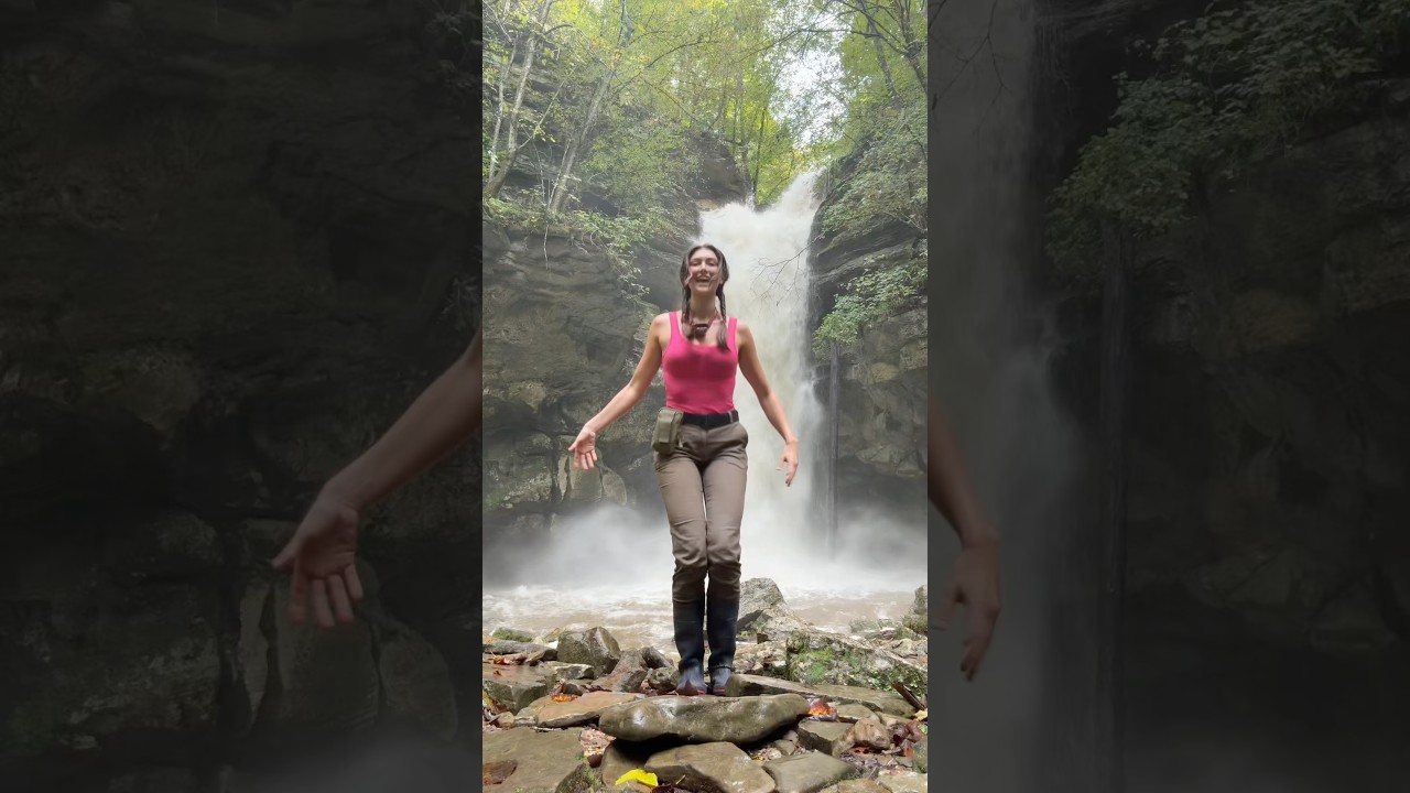 Adventurous model explores a beautiful waterfall in a stunning location