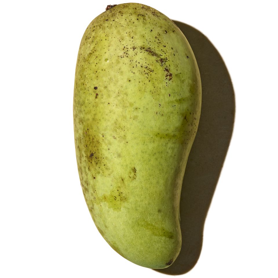 A mango variety named Irwin shown in isolation on a white background