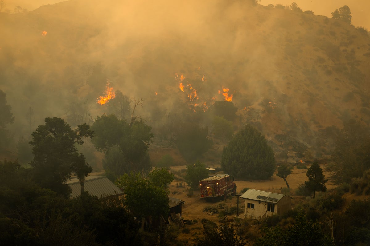 Rapidly growing wildfire in Los Angeles forces evacuations