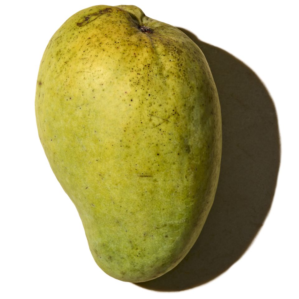 A mango viewed from above with a shadow on the right