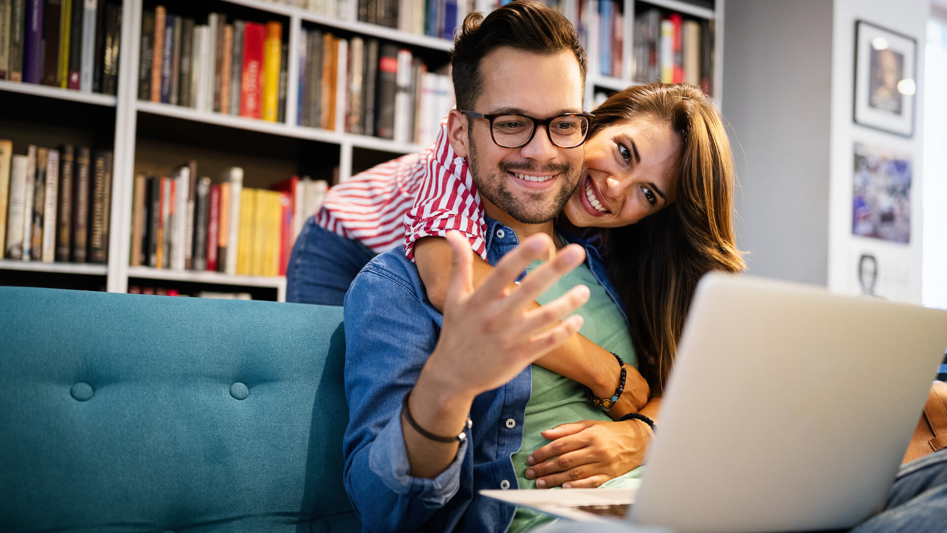 Discover a happy couple hugging each other and discussing money-saving tricks inside their home.
