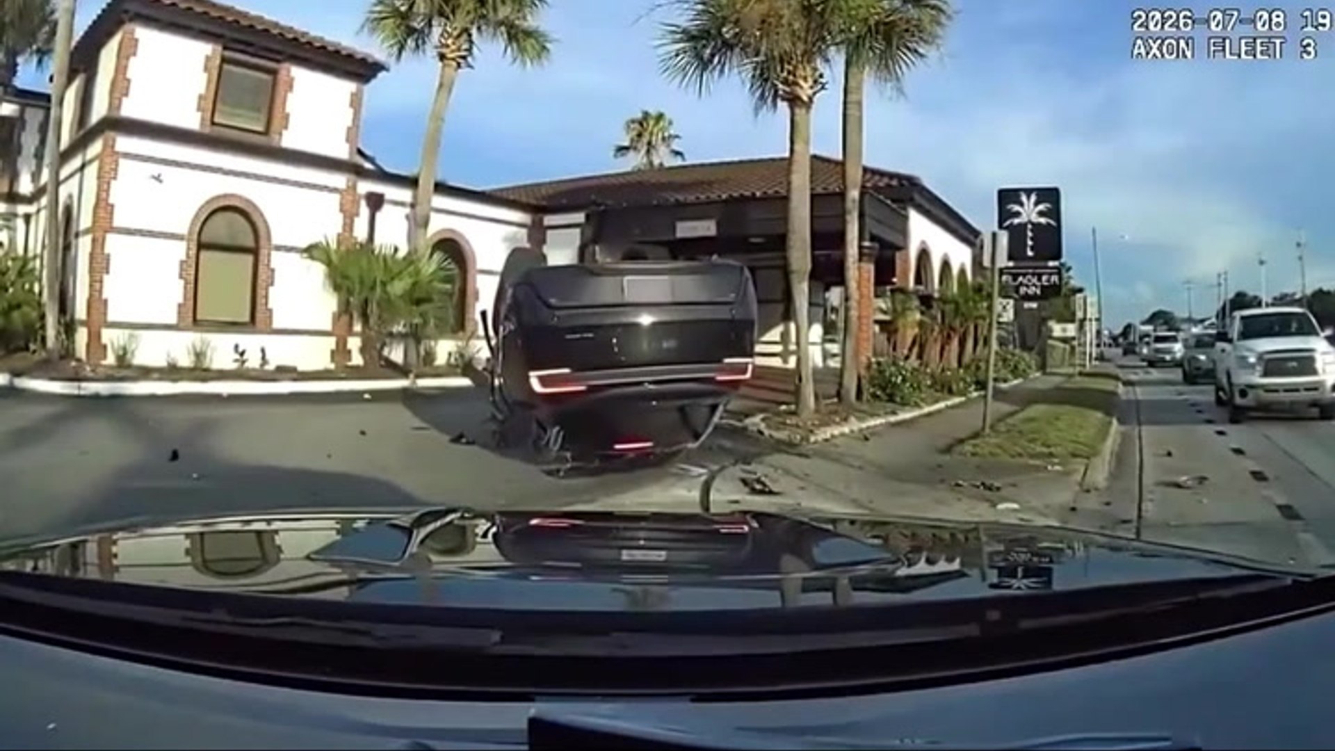 Police dashcam captures moment speeding Tesla flips in deadly Florida ...