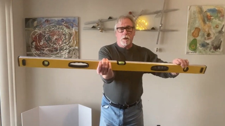Person holding Pittsburgh bubble level from Harbor Freight
