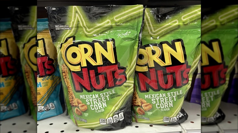 Two bags of Corn Nuts Mexican Style Street Corn sit on a grocery shelf.