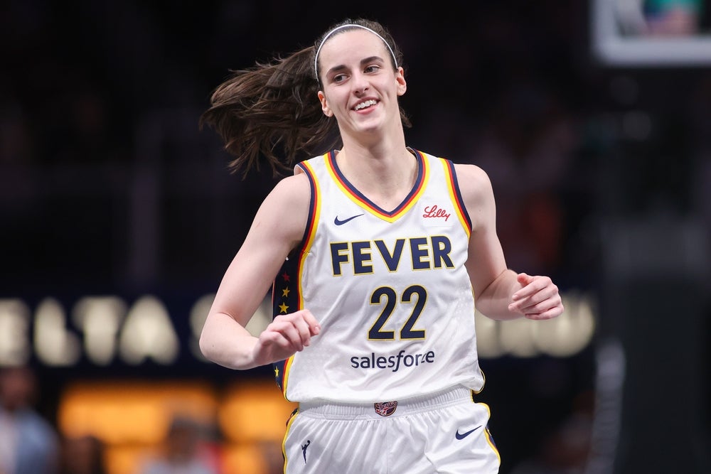 May 22, 2025; Atlanta, Georgia, USA; Indiana Fever guard Caitlin Clark (22) reacts after a basket against the Atlanta Dream in the first half at State Farm Arena. Mandatory Credit: Brett Davis-Imagn Images