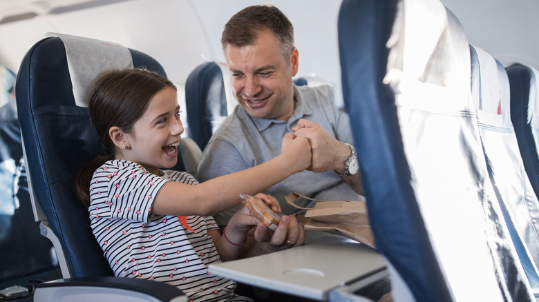 How To Handle A Kid Kicking Your Airplane Seat, According To A Flight Attendant