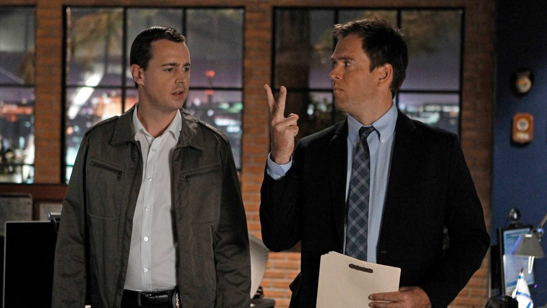 Tony making a sign to McGee in NCIS season 10