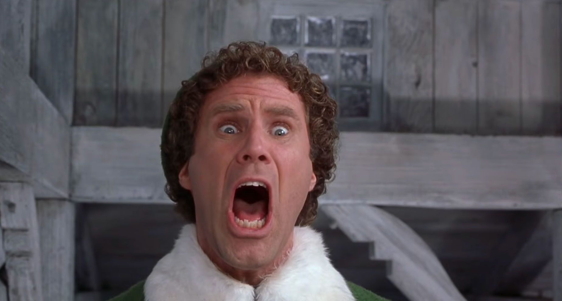 A scene featuring a person with a curly hairstyle, wearing a green outfit with a white collar, expressing surprise with their mouth open