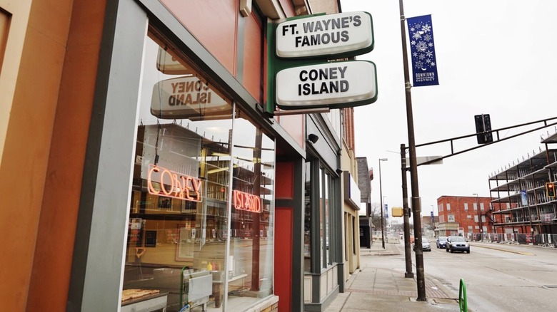 Exterior of Fort Wayne's Famous Coney Island and street on overcast day