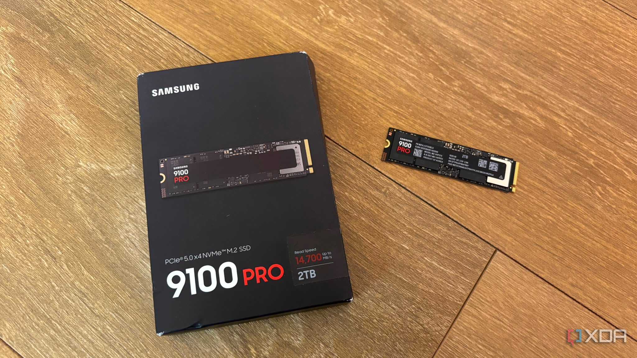 Samsung 9100 pro SSD next to box on floor