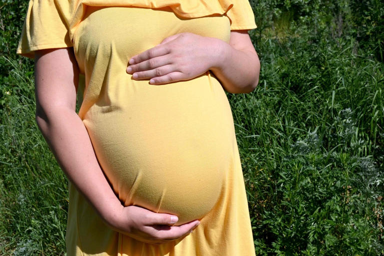 A 26-year-old Ukrainian going through her second surrogacy for a Chinese couple holds her belly in 2020. Russia and Ukraine became global surrogacy hubs after Southeast Asia clamped down on the trade. Photo: AFP