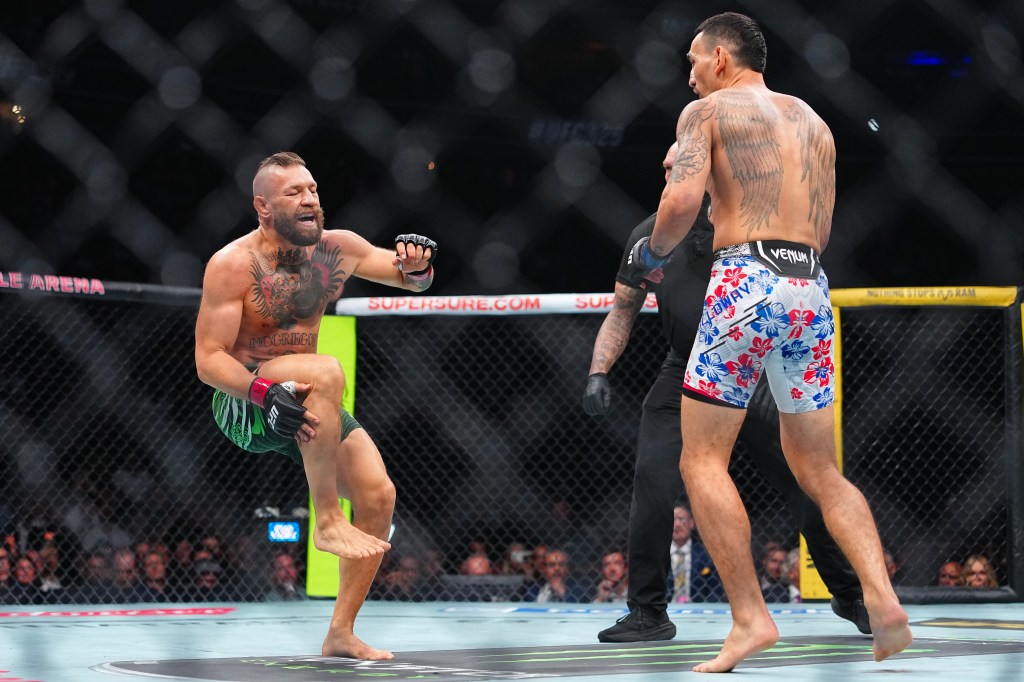 Conor McGregor injures leg seconds into fight in loss to Max Holloway ...