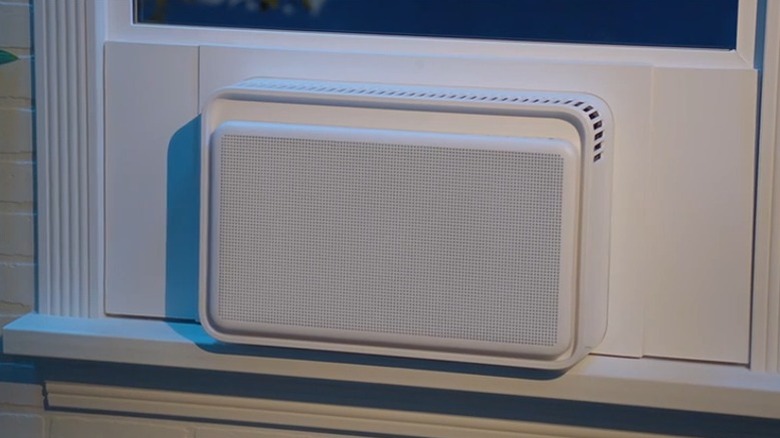 White inverter AC placed inside a house.