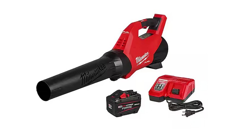 Milwaukee leaf blower, battery, and charger against a white background.