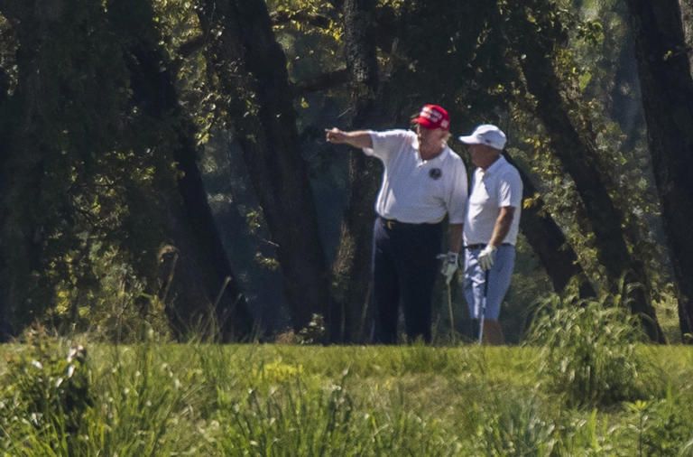 Graham playing golf with President Trump in 2020.