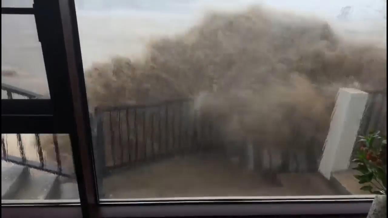 Storm surge slams into windows as Typhoon Bavi hits China's Taizhou city