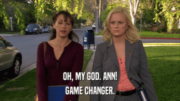 Two women walking, one in casual attire and the other in business wear, with "Oh, my god, Ann! Game changer." text overlay