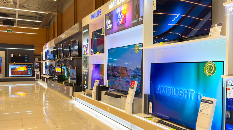 TVs on display in store