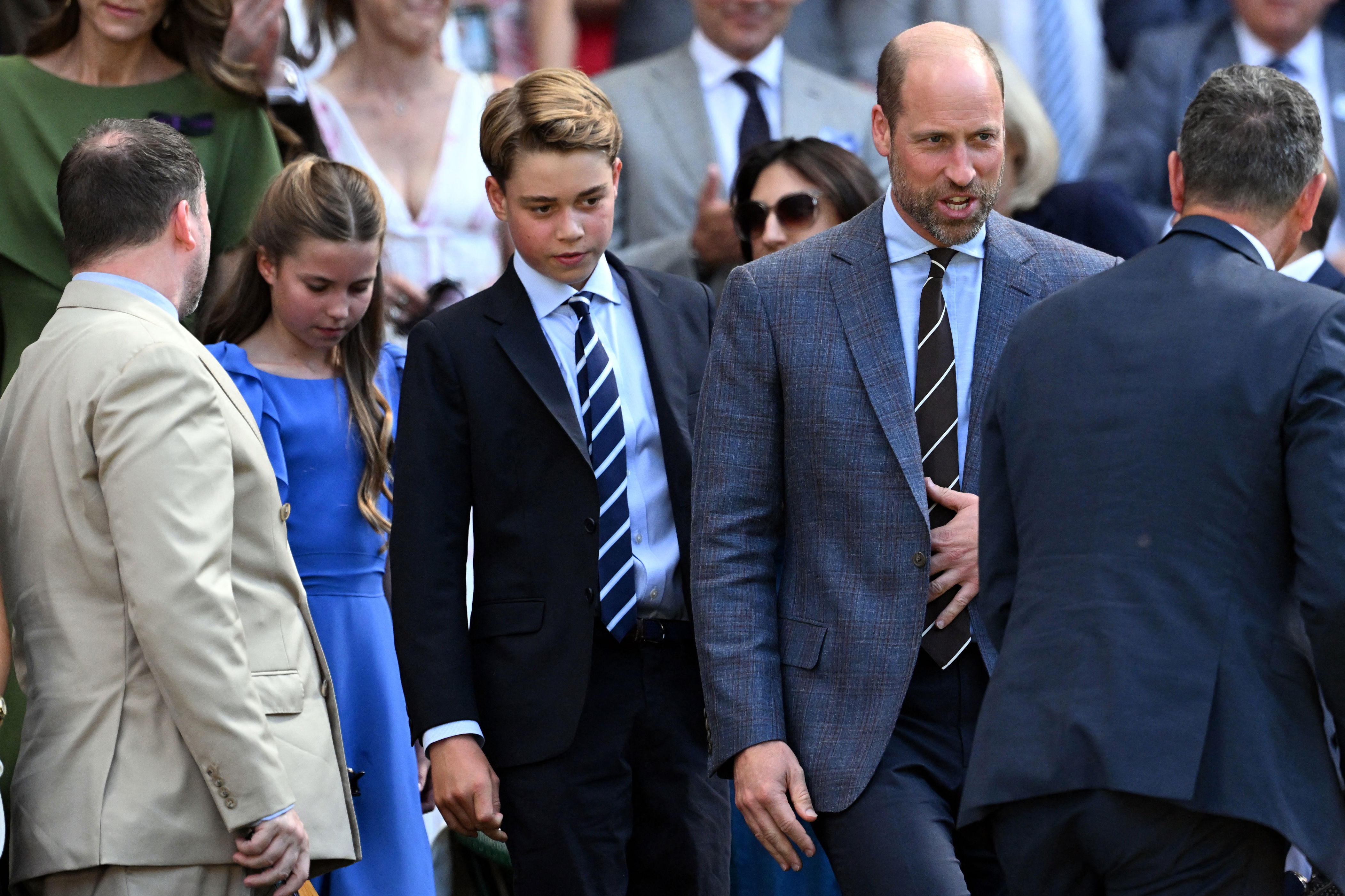 Prince William wears a suit to attend Wimbledon 2026 where he reassures his children, Prince George and Princess Charlotte, as they're met by crowds of people