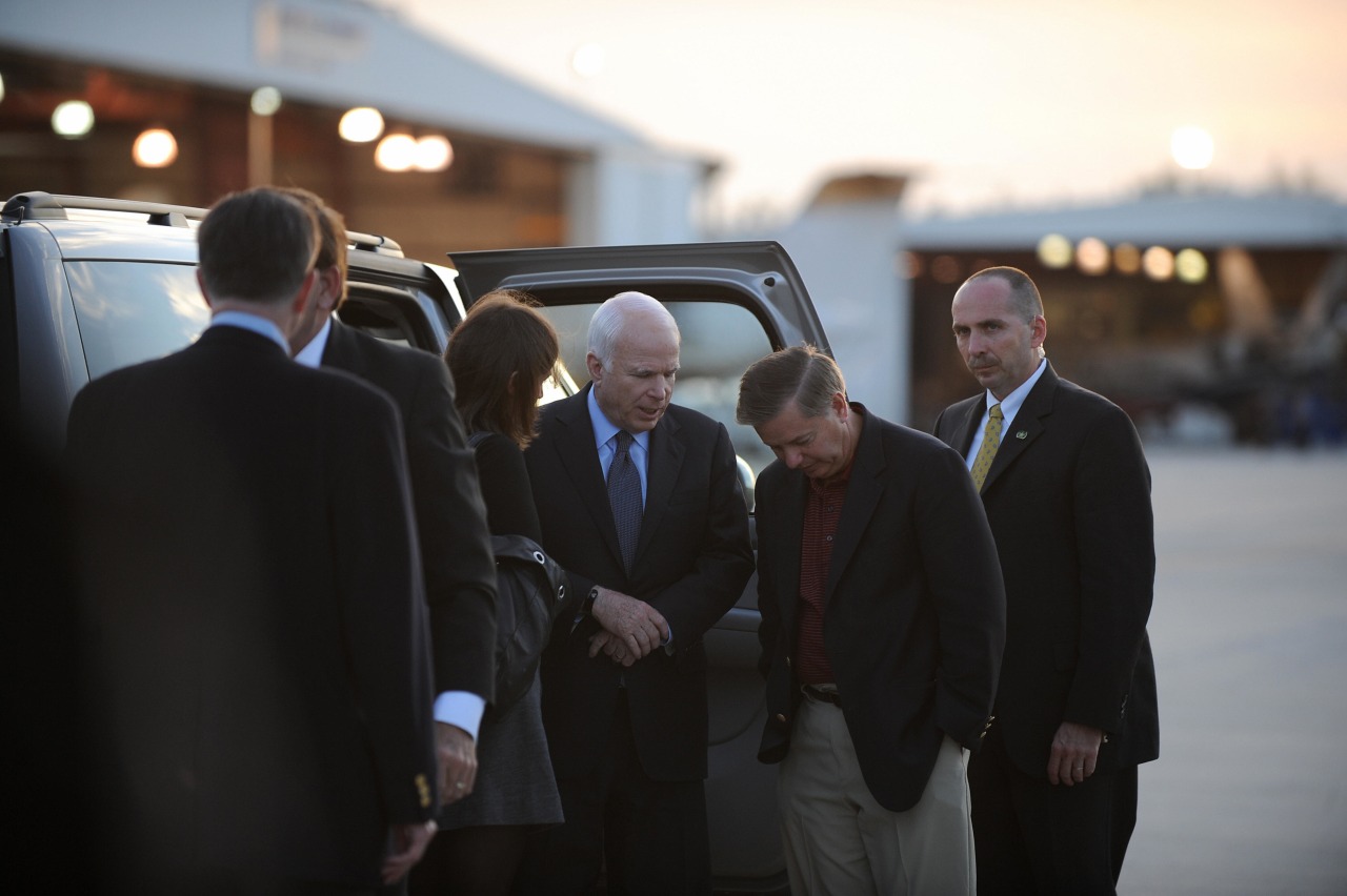Graham with Republican presidential candidate John McCain at the airport in West Palm Beach, Fla, in 2008.
