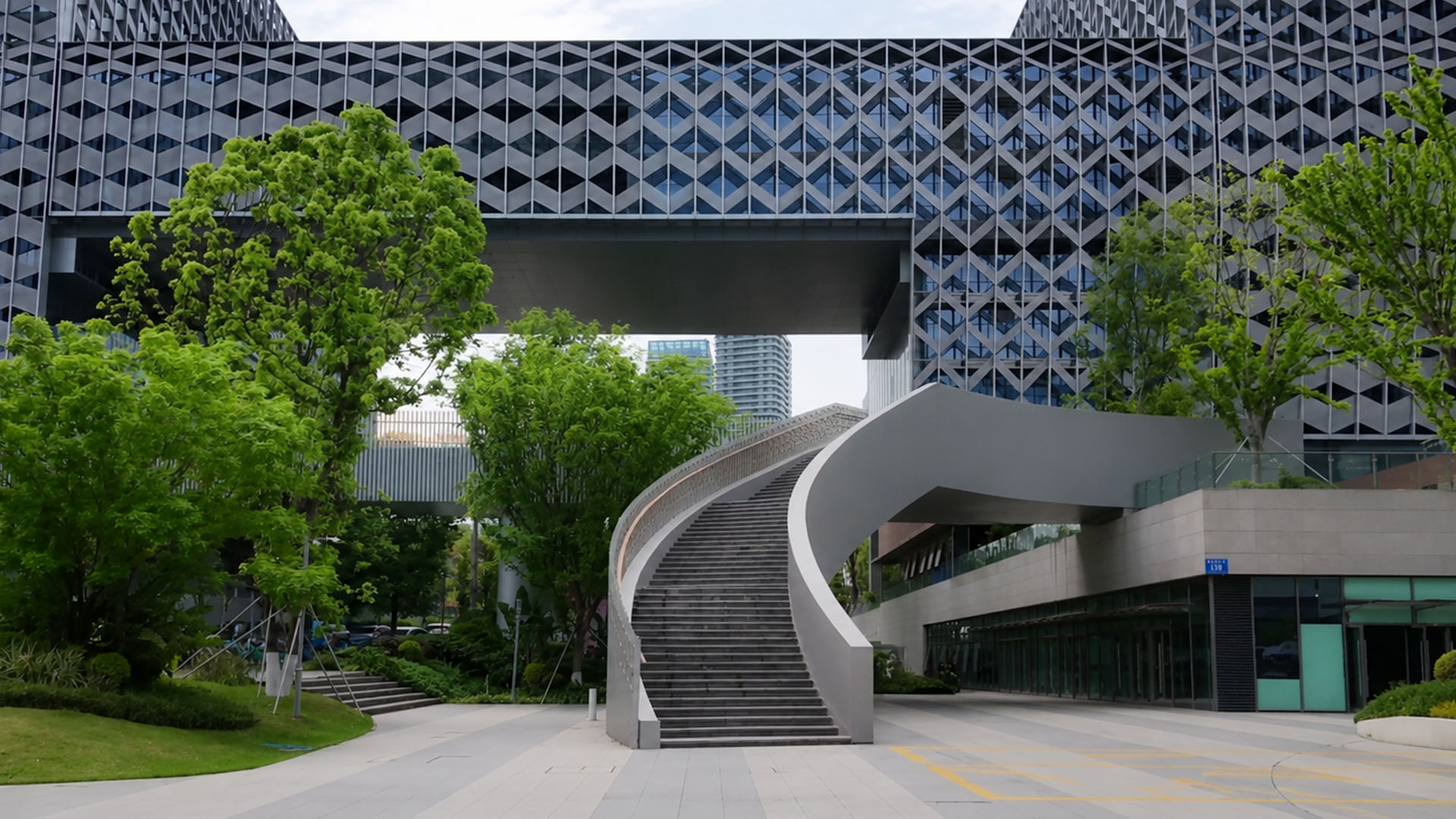 A curved stairway creates elegant access between different urban levels