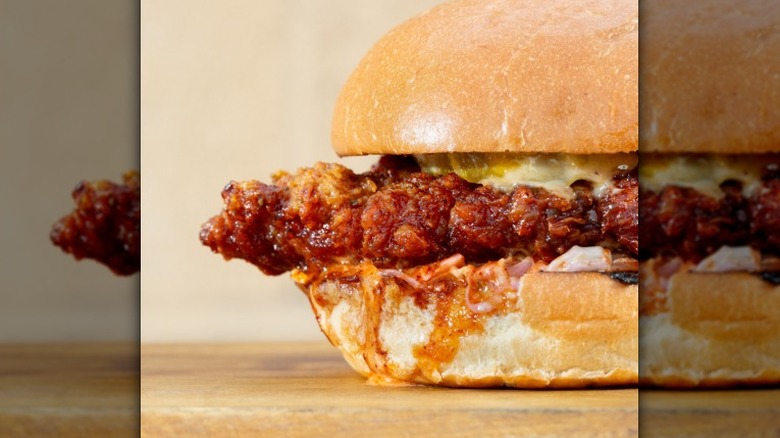 Closeup of a Hardee's Nashville Hot Hand-Breaded Chicken Sandwich