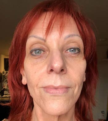 Person with short hair, neutral expression, close-up angle