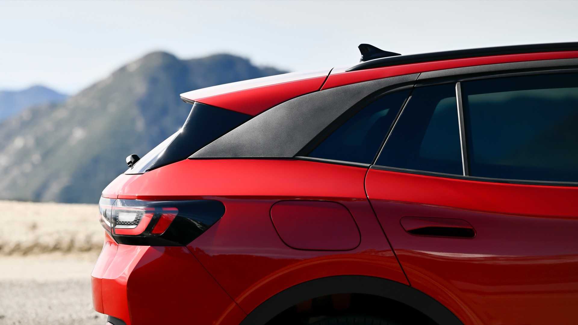 2024 Volkswagen ID.4 in red, exterior photo of rear quarter panel