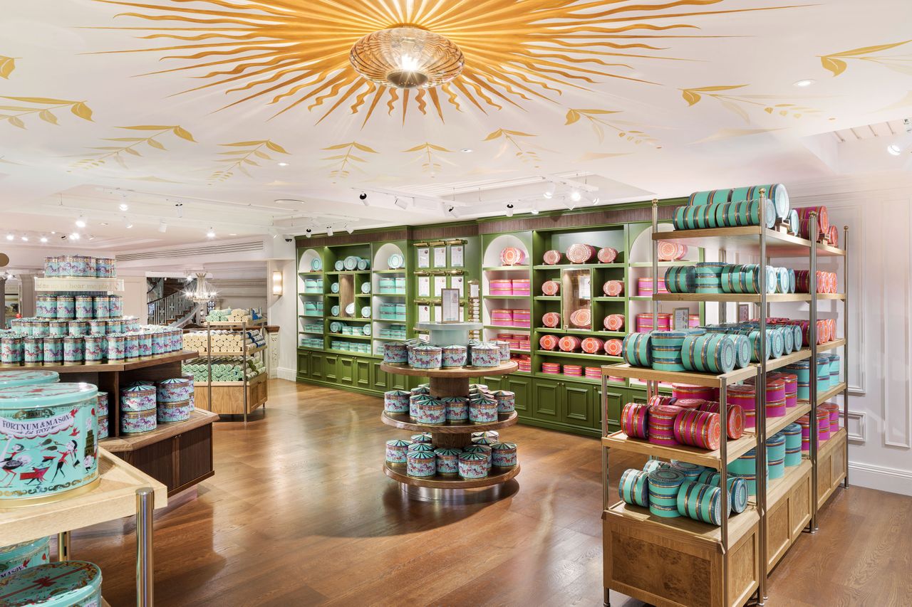 Interior of the Fortnum Mason Biscuitorium shelves displaying packaged biscuits and decorative tins